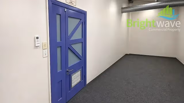 168 m2 office to let at Waverley Business Park in Observatory, corridor interior.