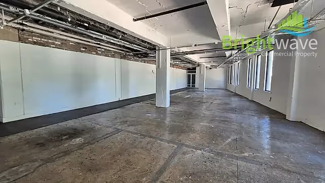 400 m2 office to let at Tramways Building in Woodstock, open plan interior.